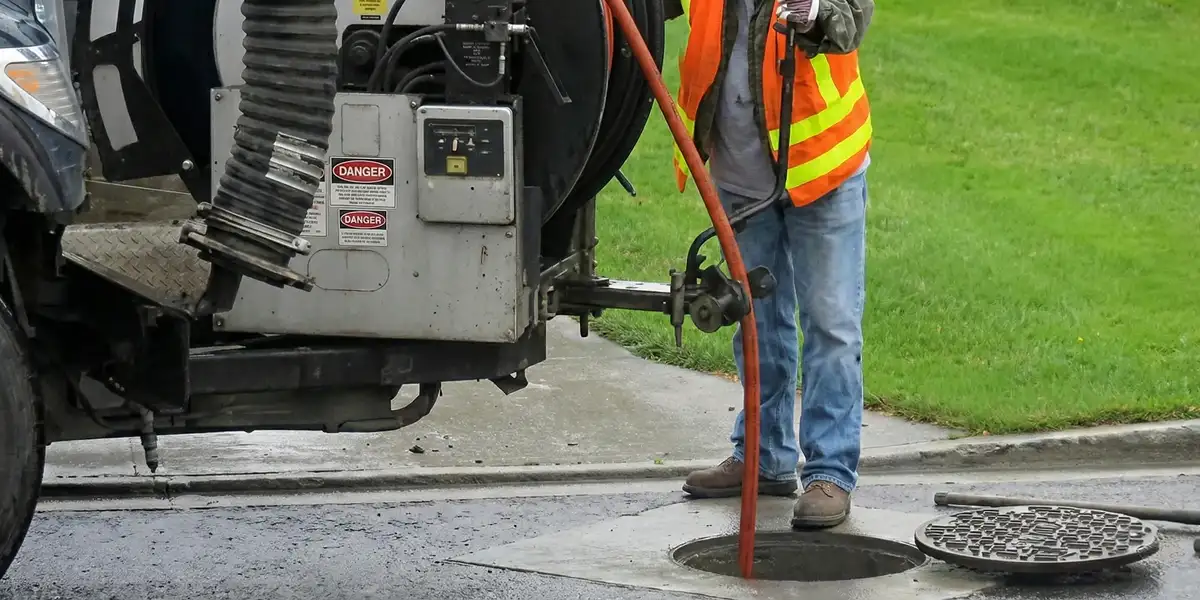 sewage clean up professionals using industrial equipment to remove contaminated wastewater in Sacramento, CA