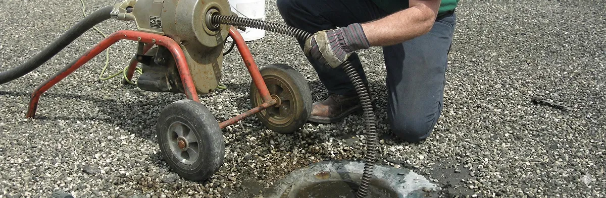 sewer rodding technician actively removing blockages from a sewer line in Sacramento, CA