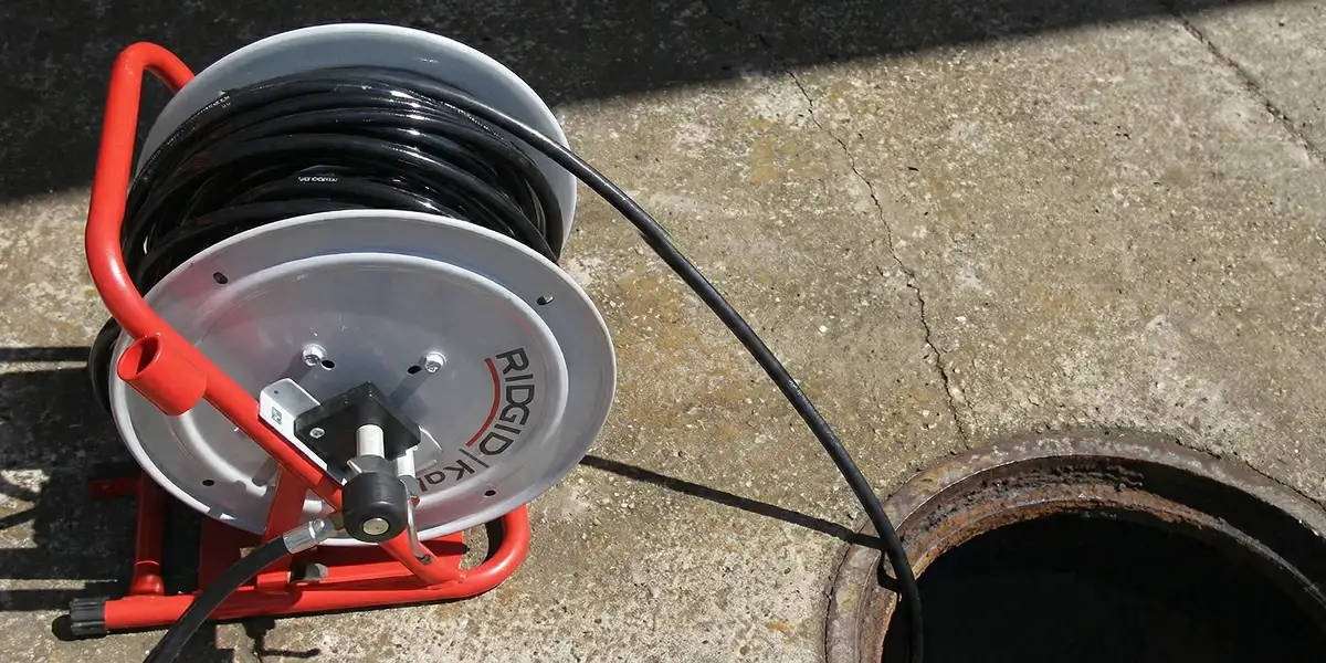 sewer rodding equipment prepared to clear clogged sewer lines in Sacramento, CA