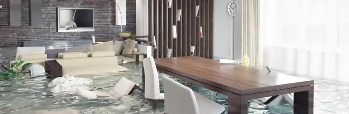 home interior affected by water damage with flooded floors and displaced furniture in Sacramento, CA